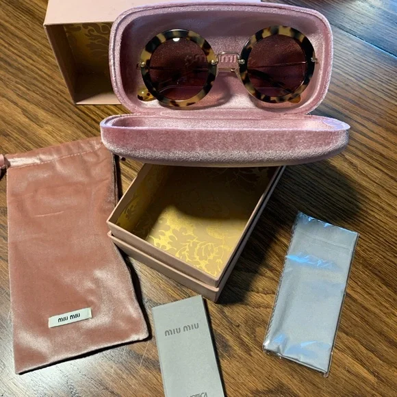 NWT Miu Miu round sunglasses. Comes with all original boxes, duster etc. Miu Miu MU 04ZS VAU50D Honey Havana Sunglasses for Woman  main image 4